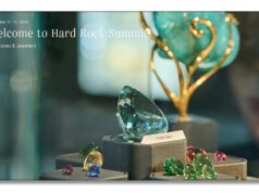 September HardRock Summit 2025: Gems, Minerals, Fossils, and One Seriously Expanded Showcase! Glass art pieces displayed on a table near a decorative lamp.