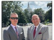 AGTA Continues the Fight in Washington: Gem Imports Still at Risk of Tariffs Two men in suits standing outdoors with the Capitol building in the background.