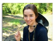No Budget for a Diamond? — You can Dig One Up for the Cost of an Entrance Fee Young woman outdoors smiling with a sun hat.