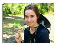No Budget for a Diamond? — You can Dig One Up for the Cost of an Entrance Fee Young woman outdoors smiling with a sun hat.
