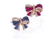 The Italians are Coming! The Edit: A Gallery of Italian Jewelry Masterpieces Elegant bow-shaped rings with blue and red gemstones on a white background.
