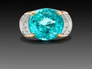 ZaZa Azul: A Paraíba for the People Elegant ring with a large blue gemstone and gold accents.