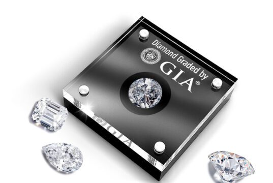 Holiday 24-Hour Diamond Services at GIA’s Gem Lab A GIA-certified diamond with loose diamonds beside it.
