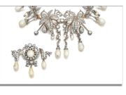 Sotheby’s Royal & Noble Jewels: Old Cuts, Natural Pearls, Tiaras, and Where Bids Soared Past Estimates! Intricate vintage pearl necklace with matching brooch.